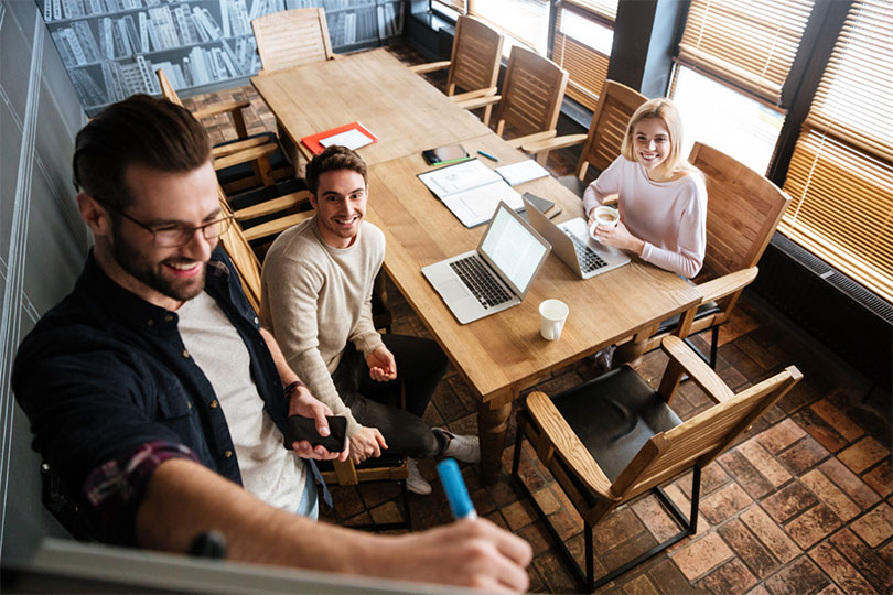 young colleagues sitting while working